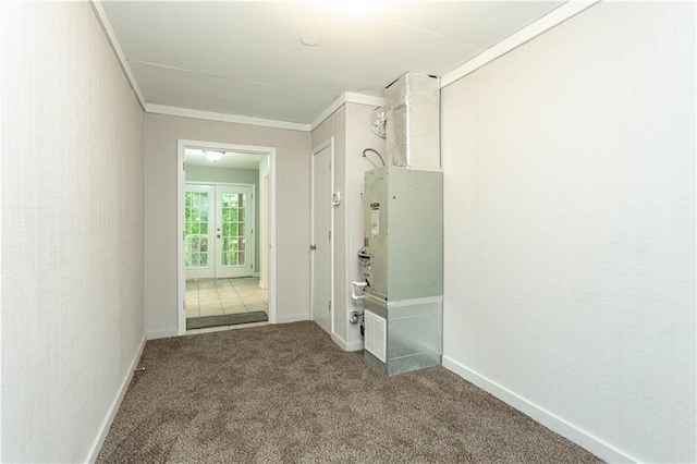 interior space featuring light colored carpet and ornamental molding