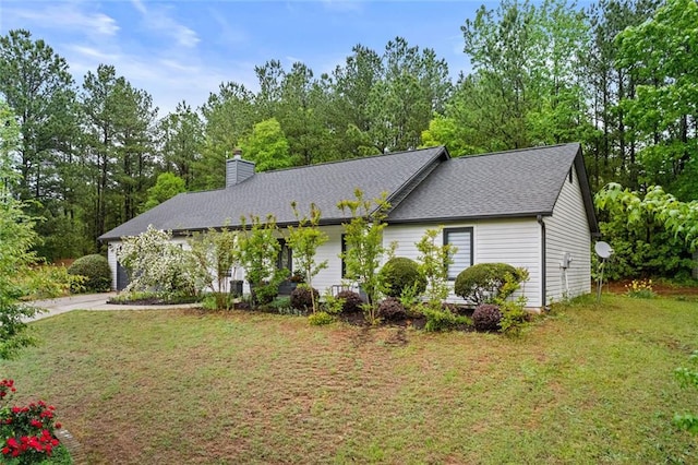 415 Southridge Rd, Winder, GA 30680 - view of front of house featuring a chimney, a front lawn, concrete driveway, and a garage