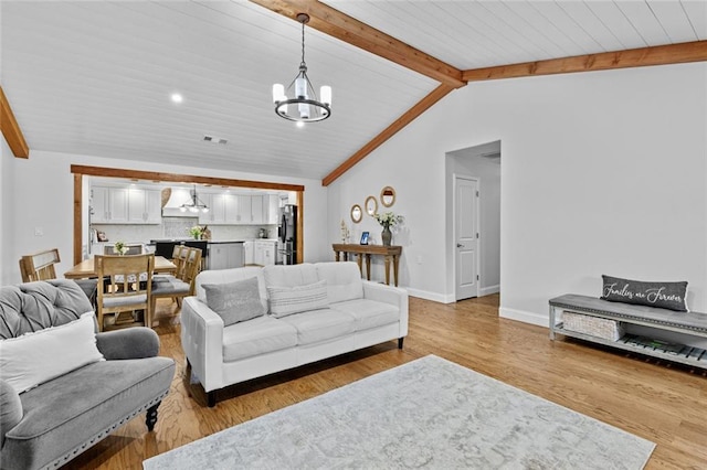 415 Southridge Rd, Winder, GA 30680 - living room with a chandelier and light wood-style floors