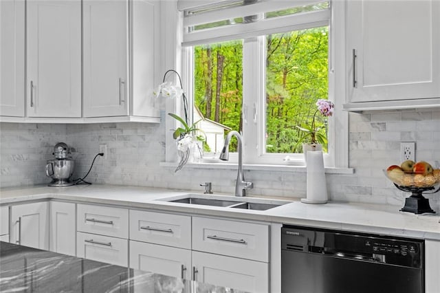 415 Southridge Rd, Winder, GA 30680 - kitchen with dishwasher, white cabinetry, tasteful backsplash, light stone countertops, and healthy amount of natural light