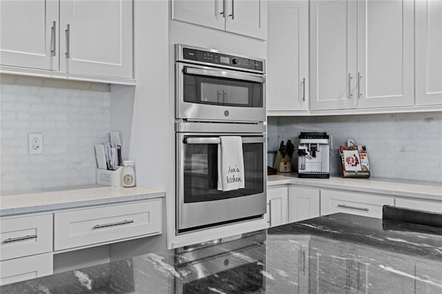 415 Southridge Rd, Winder, GA 30680 - kitchen featuring double oven, backsplash, and white cabinets