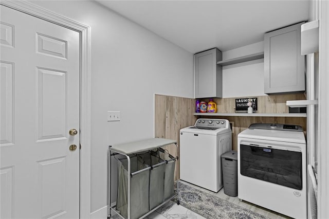 415 Southridge Rd, Winder, GA 30680 - washroom with washer and clothes dryer, cabinet space, and light marble finish floors