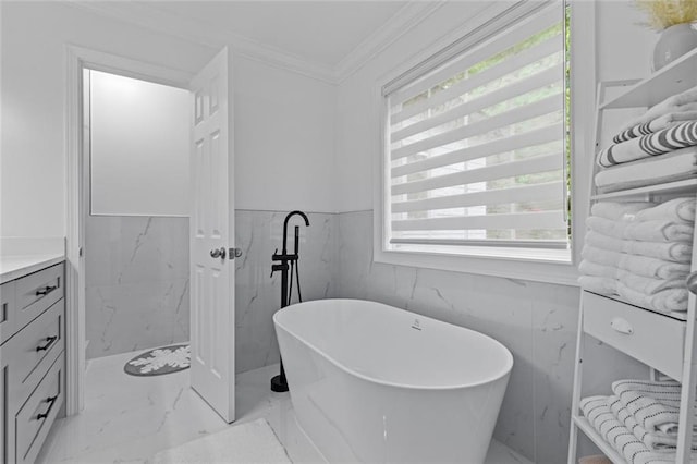 415 Southridge Rd, Winder, GA 30680 - full bath with marble finish flooring, a soaking tub, vanity, wainscoting, and crown molding