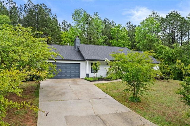 415 Southridge Rd, Winder, GA 30680 - view of front of house featuring driveway, a garage, and a chimney