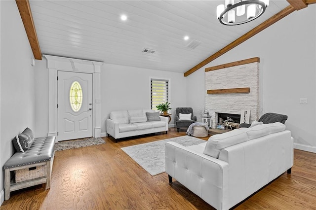 415 Southridge Rd, Winder, GA 30680 - living area featuring vaulted ceiling, a chandelier, wood finished floors, a fireplace, and wood ceiling