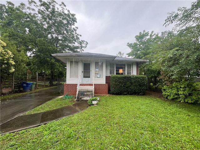 301 Sisson Ave NE, Atlanta, GA 30317 - view of front facade with a front yard and brick siding
