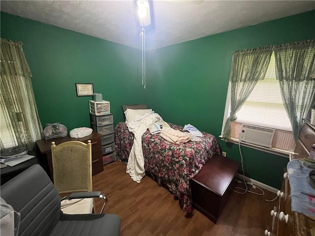 301 Sisson Ave NE, Atlanta, GA 30317 - bedroom featuring wood finished floors, cooling unit, baseboards, and a textured ceiling