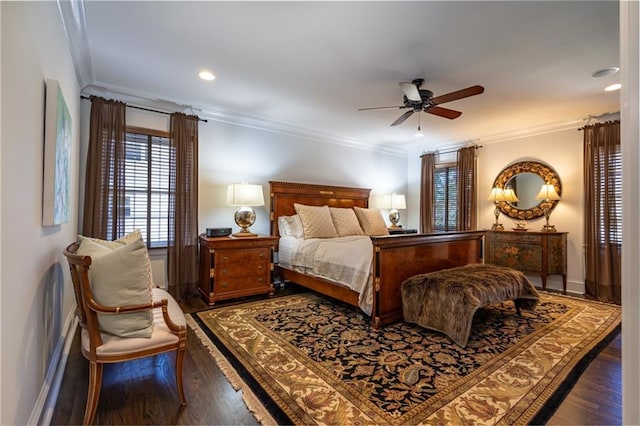 bedroom with ornamental molding, a ceiling fan, baseboards, and wood finished floors