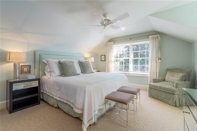 carpeted bedroom featuring vaulted ceiling, ceiling fan, and baseboards