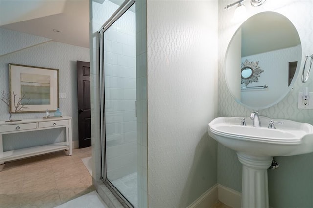 full bath featuring baseboards, a stall shower, and wallpapered walls