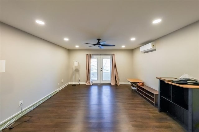 unfurnished living room featuring french doors, a ceiling fan, a wall unit AC, and dark wood-style flooring