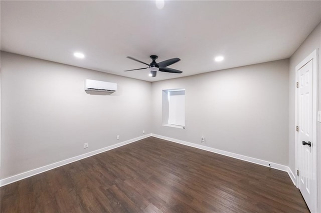 unfurnished room featuring a ceiling fan, baseboards, dark wood finished floors, recessed lighting, and an AC wall unit