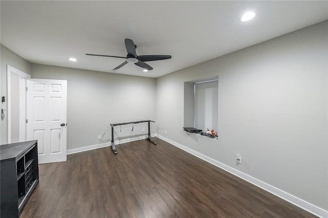 spare room featuring recessed lighting, baseboards, ceiling fan, and dark wood-style flooring