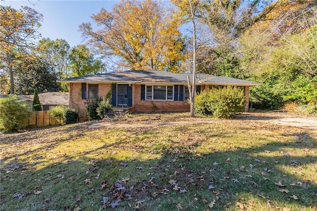 ranch-style house with a front lawn