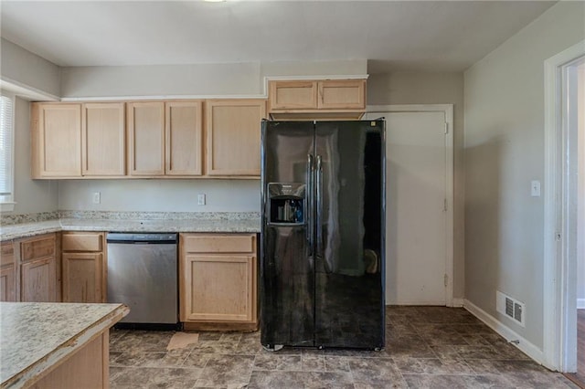 kitchen featuring dishwasher, light brown cabinets, and black fridge