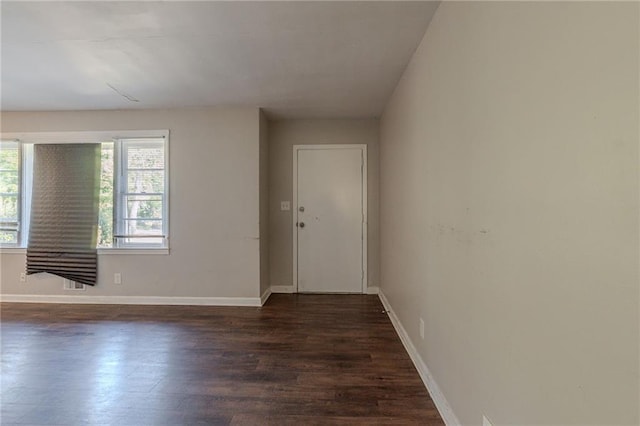 foyer entrance with dark wood-type flooring