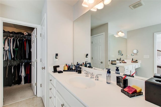 bathroom with vanity and tile patterned floors