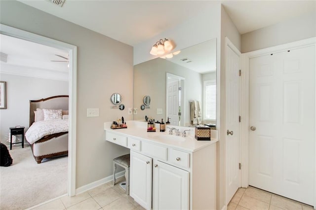 bathroom featuring tile patterned flooring and vanity