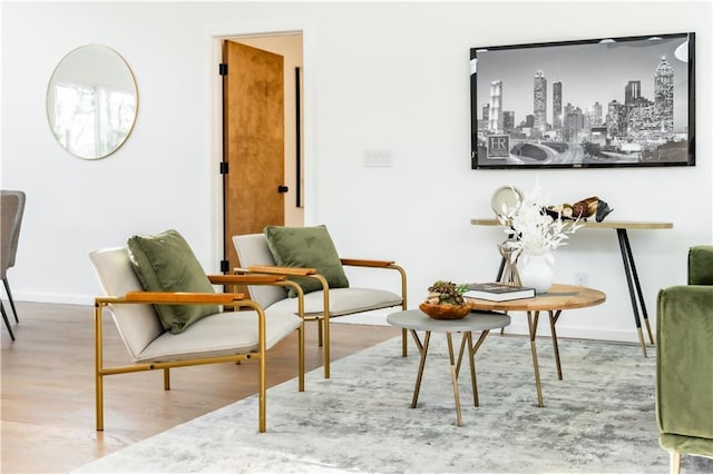 living area with hardwood / wood-style floors