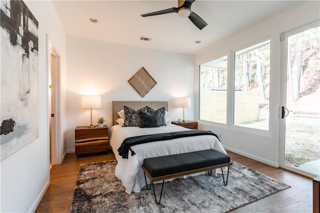 bedroom with ceiling fan, hardwood / wood-style flooring, and access to outside