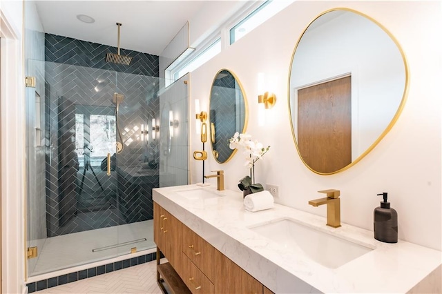 bathroom featuring walk in shower and vanity