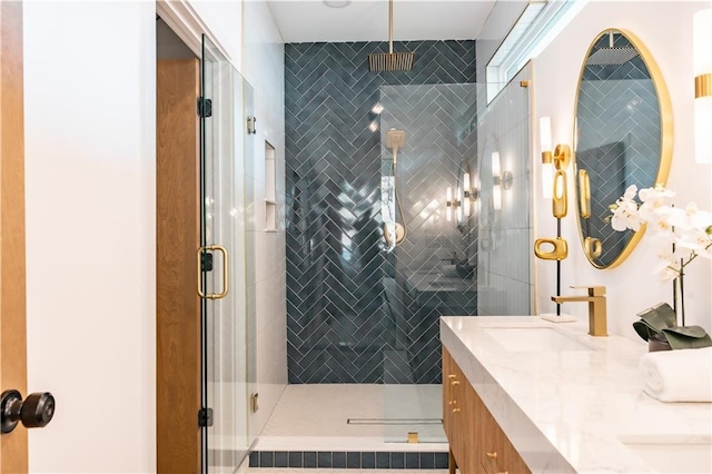 bathroom featuring vanity and an enclosed shower