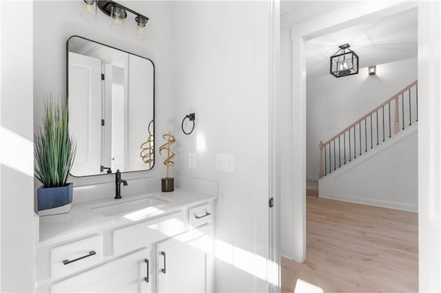 bathroom with vanity and hardwood / wood-style flooring