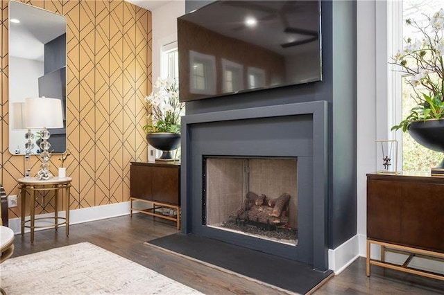 1821 Huntington Hills Ln NW, Atlanta, GA 30309 - detailed view of an accent wall, a fireplace, wood finished floors, and baseboards