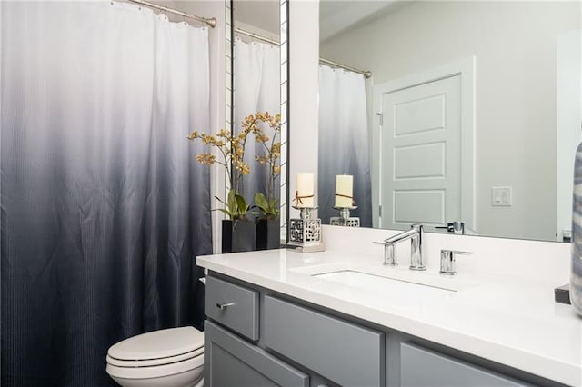 1821 Huntington Hills Ln NW, Atlanta, GA 30309 - bathroom featuring vanity, toilet, and curtained shower