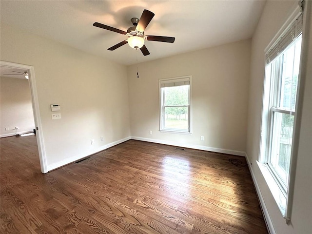 44 Powell Rd NW, Adairsville, GA 30103 - spare room featuring a ceiling fan, dark wood-style floors, and baseboards