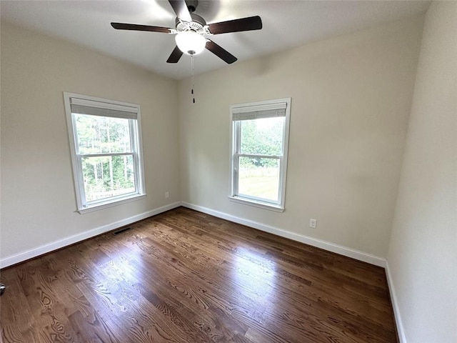 44 Powell Rd NW, Adairsville, GA 30103 - spare room with plenty of natural light, a ceiling fan, and dark wood-style flooring
