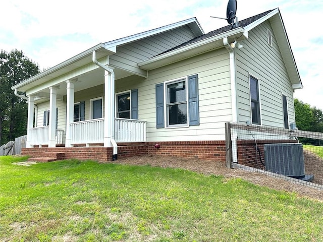 44 Powell Rd NW, Adairsville, GA 30103 - view of side of home featuring central AC, a porch, and a lawn