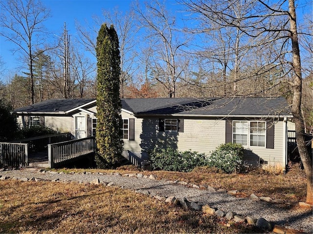 view of front of house with a wooden deck