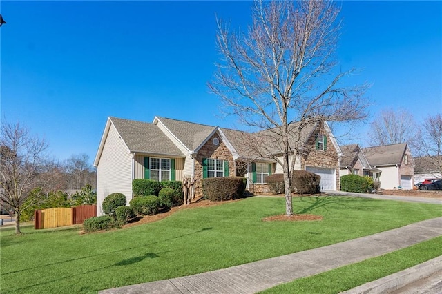 view of front of house featuring a garage and a front lawn