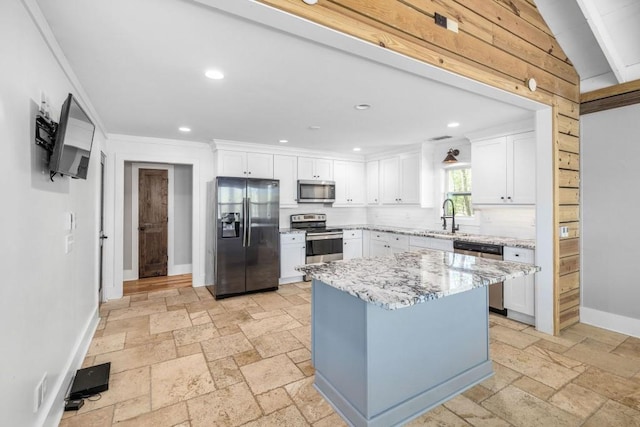 3868 Jack Wilson Rd, Gainesville, GA 30506 - kitchen featuring stainless steel appliances, stone tile flooring, baseboards, recessed lighting, and a sink