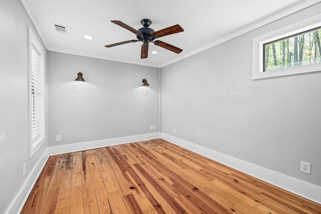 empty room with a ceiling fan, baseboards, wood-type flooring, and recessed lighting