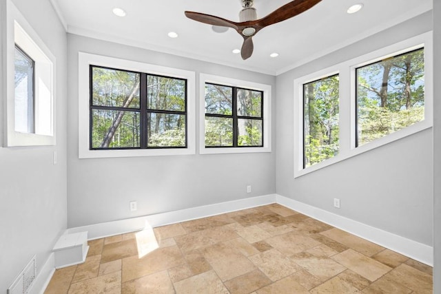 unfurnished room featuring baseboards, stone tile flooring, a ceiling fan, recessed lighting, and ornamental molding