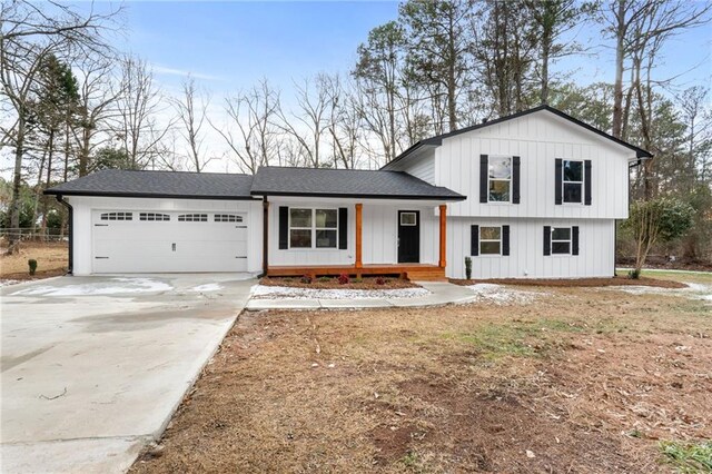 view of front of house with a garage and a porch