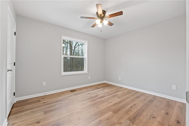 unfurnished room with ceiling fan and light wood-type flooring