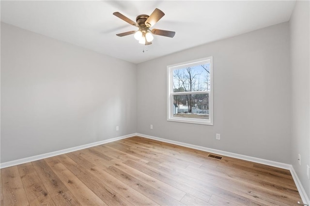 spare room with ceiling fan and light hardwood / wood-style floors