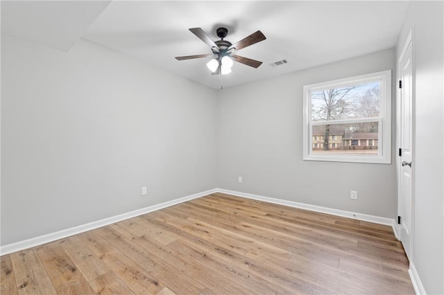 unfurnished room with ceiling fan and light hardwood / wood-style floors