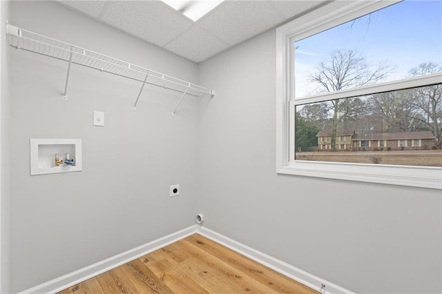 laundry room featuring hardwood / wood-style flooring, hookup for a washing machine, and electric dryer hookup