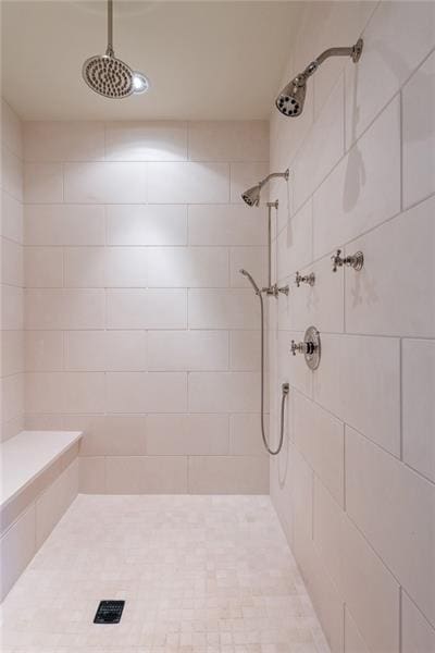 bathroom with tiled shower