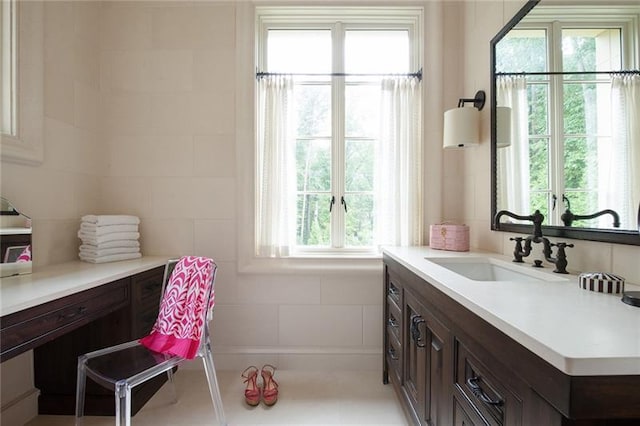 bathroom featuring a wealth of natural light and oversized vanity