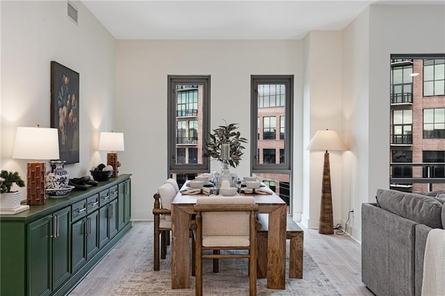 dining room with light wood-type flooring