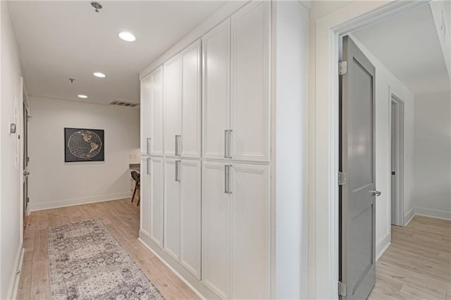 corridor featuring light hardwood / wood-style floors