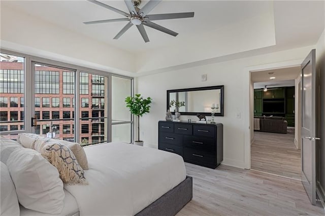 bedroom featuring ceiling fan and light hardwood / wood-style floors