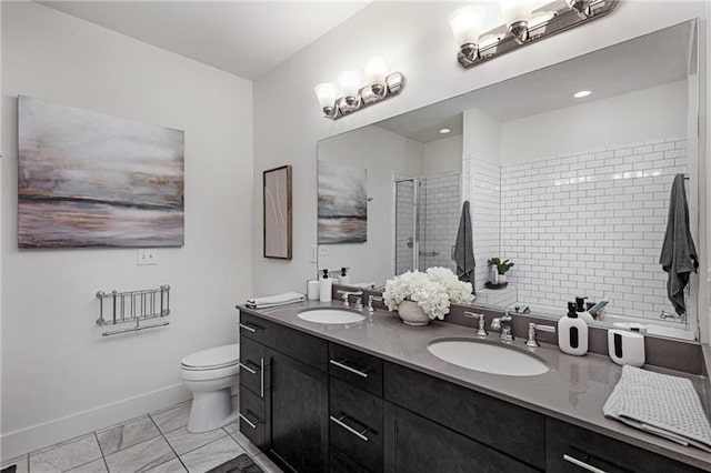 bathroom with walk in shower, vanity, and toilet