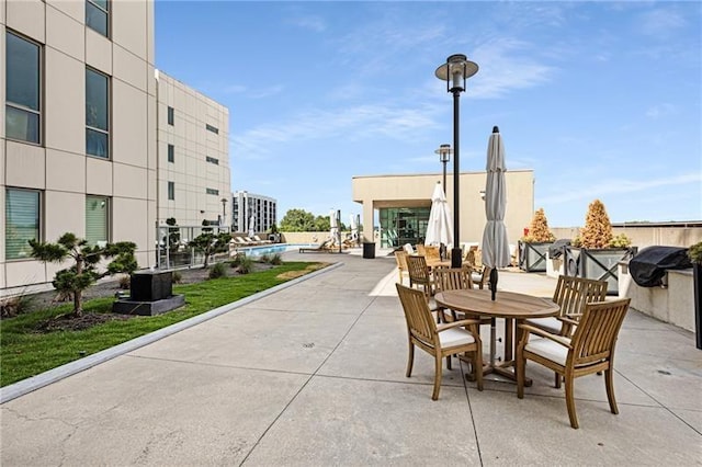 view of patio / terrace with a pool