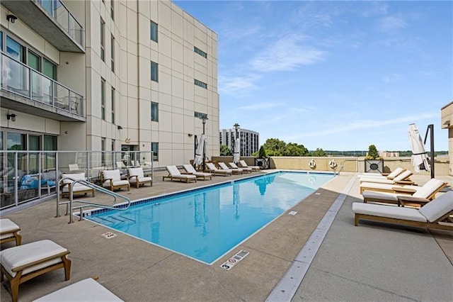 view of swimming pool featuring a patio area